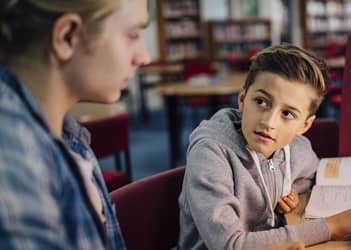 UB student tutoring a child