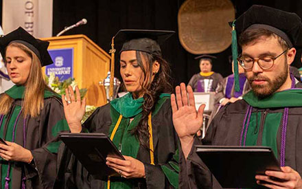 UB students taking oaths at Commencement