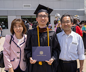 Sungkeel Yamada and his parents at Commencement 2021