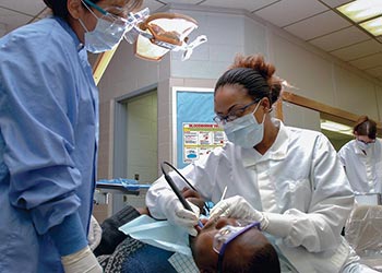 UB Dental Hygiene student with professor