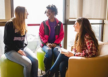 Group of 3 students talking