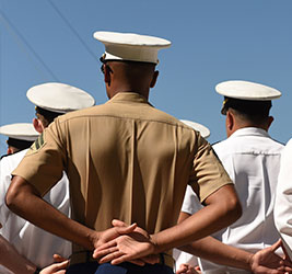 A group of Naval officers from behind