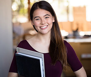 UB student holding books