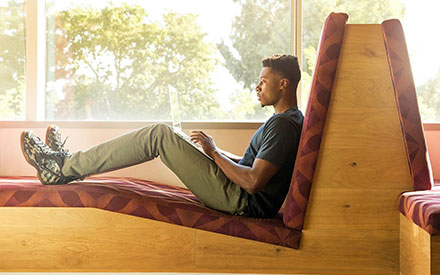 A UB student studying on a laptop