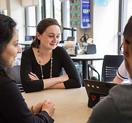 UB Students working at a table