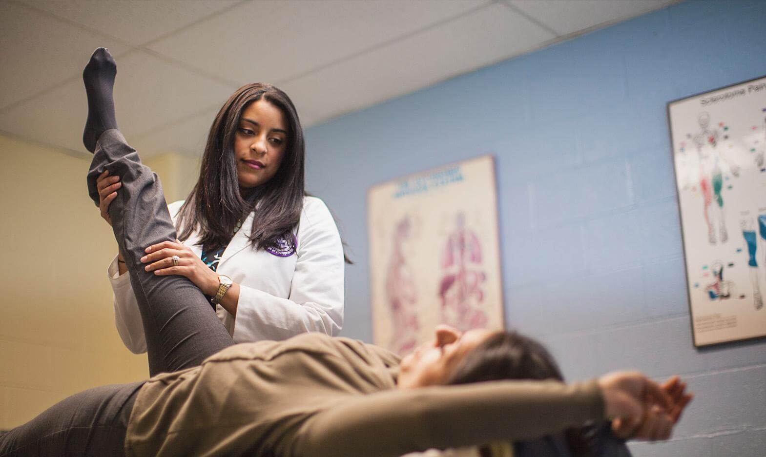 A UB Chiropractic student working on a patient