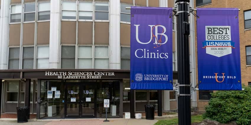 exterior of health sciences building showing UB clinics sign