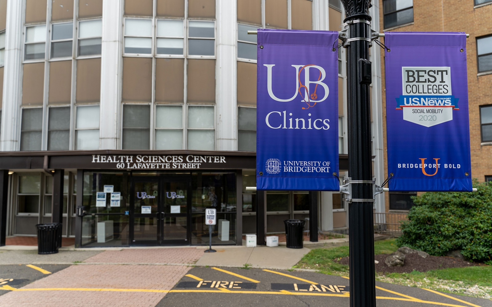 exterior of health sciences building showing UB clinics sign