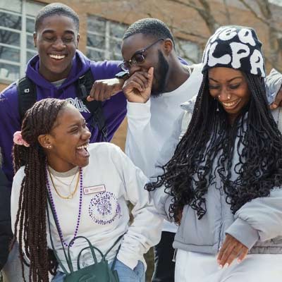 group of students smiling and laughing