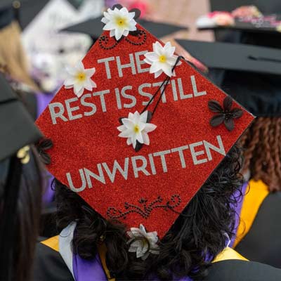 graduation cap that says the rest is still unwritten