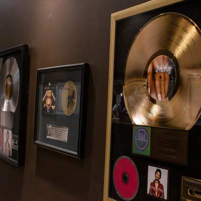 Grammy awards hanging in a hallway
