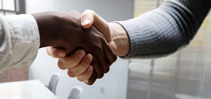 two people shaking hands