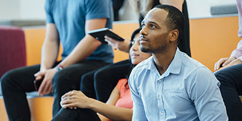 A student earning a business administration degree in CT