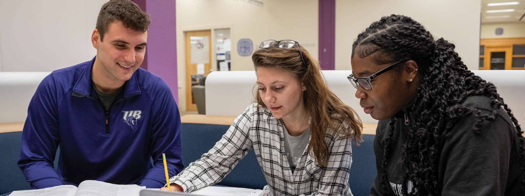 three students studying