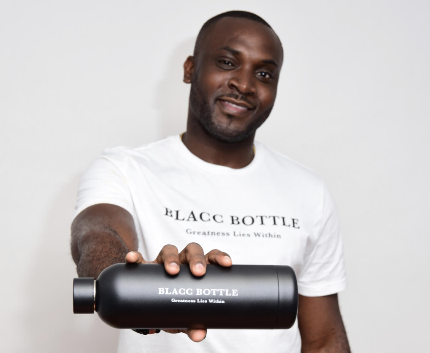 Necas Collins holding a BLACC bottle